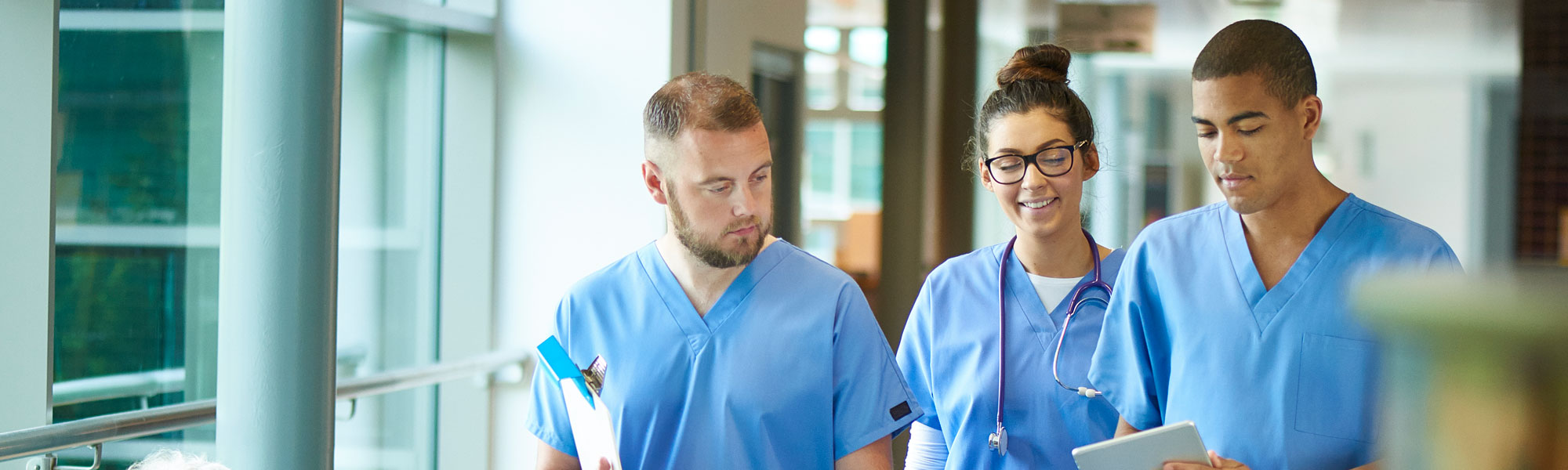 Medical providers walking down hall Medical providers walking down hall