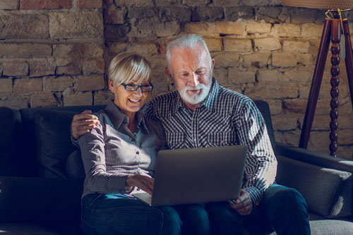 Senior Couple looking at computer