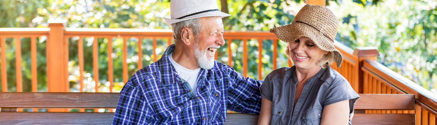 Senior Couple laughing on porch
