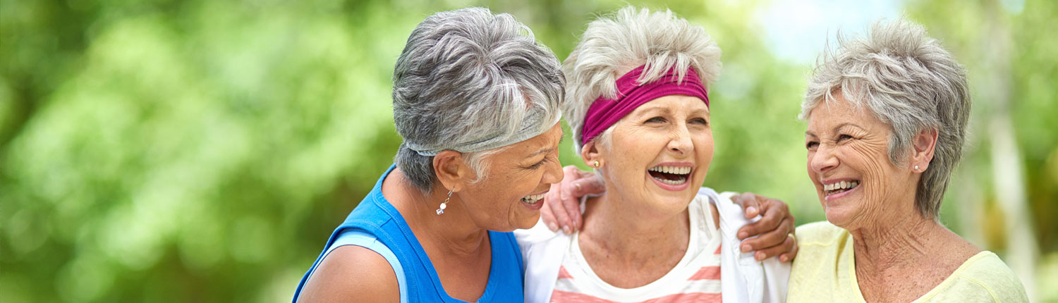 Three senior women laughing