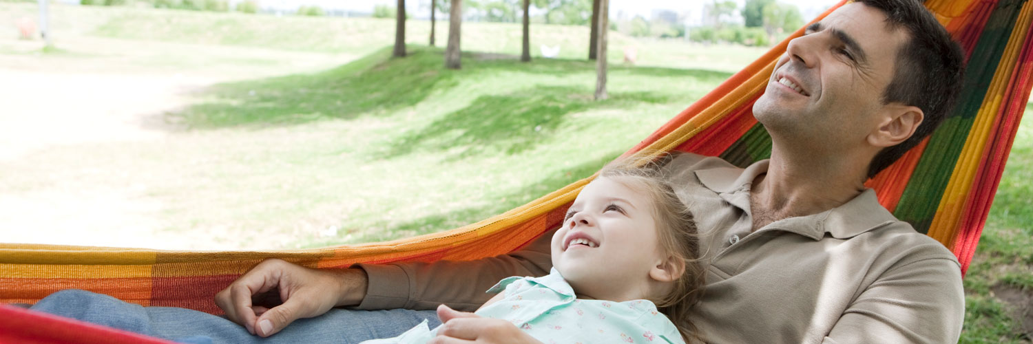 Dad and daughter in hammock