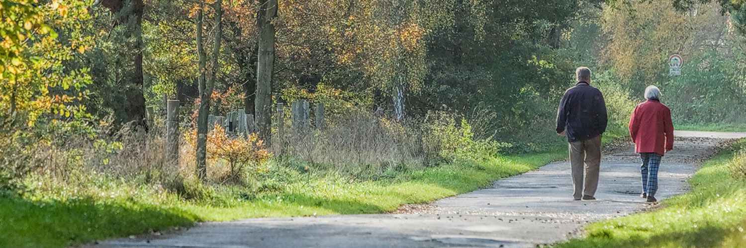 Senior couple walking on trail